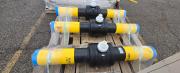 Bulk lot of polyethylene gas line materials including PolyValve valves, Performance Pipe fittings, risers, and assorted components, surplus.