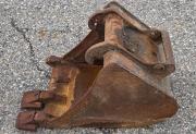Heavy-duty excavator digging bucket with teeth, used condition with surface rust-