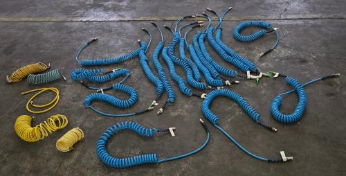 Lot of Assorted Coiled Pneumatic Air Hoses with Quick-Connect Fittings. - Image 1
