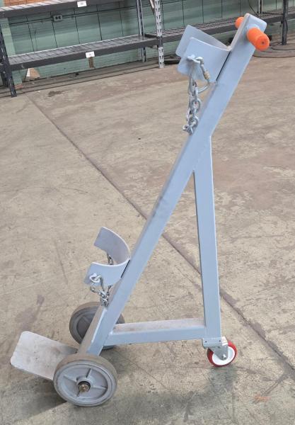 Heavy-duty steel cylinder cart designed to transport compressed gas cylinders.  - Image 1