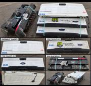 Mixed lot of used pickup truck body parts, consisting of three tailgates and three rear bumpers. 
