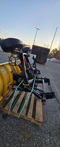 Fisher snowplow blade assembly with black mounting frame and hydraulic/electrical components. - Image 4